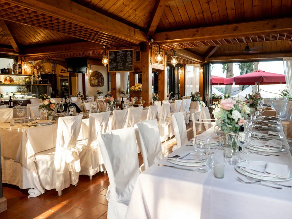  Reception hall with tables and chairs set for the party