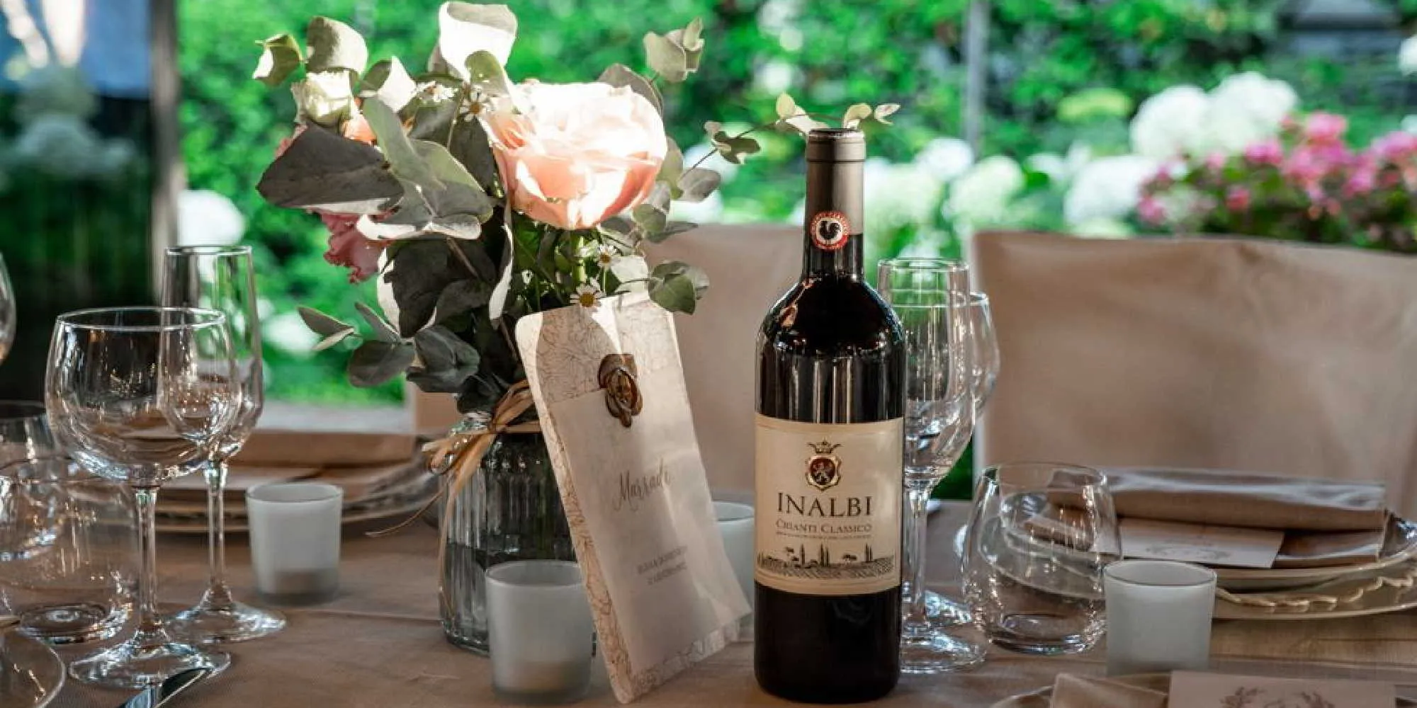  Wedding table set outdoors with a bottle of Inalbi Chianti Classico